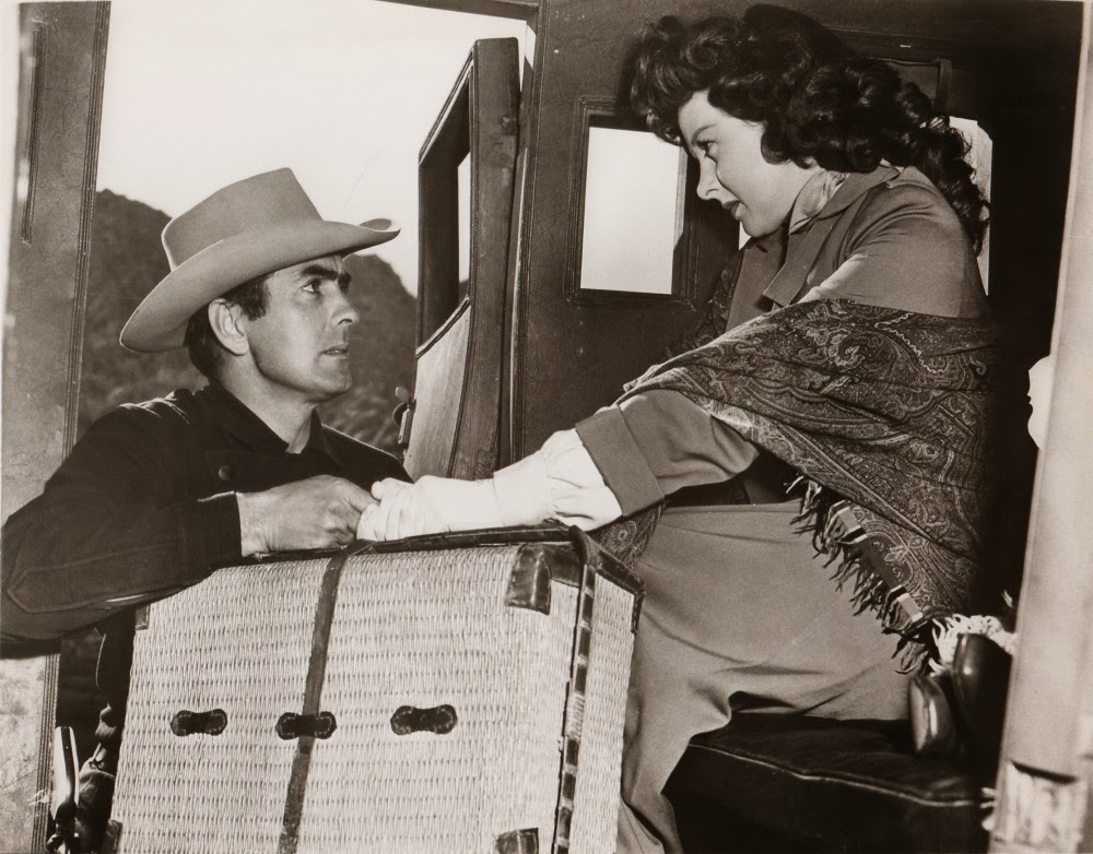 Tyrone Power greets Susan Hayward in RAWHIDE.